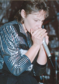 Lynette playing harmonica